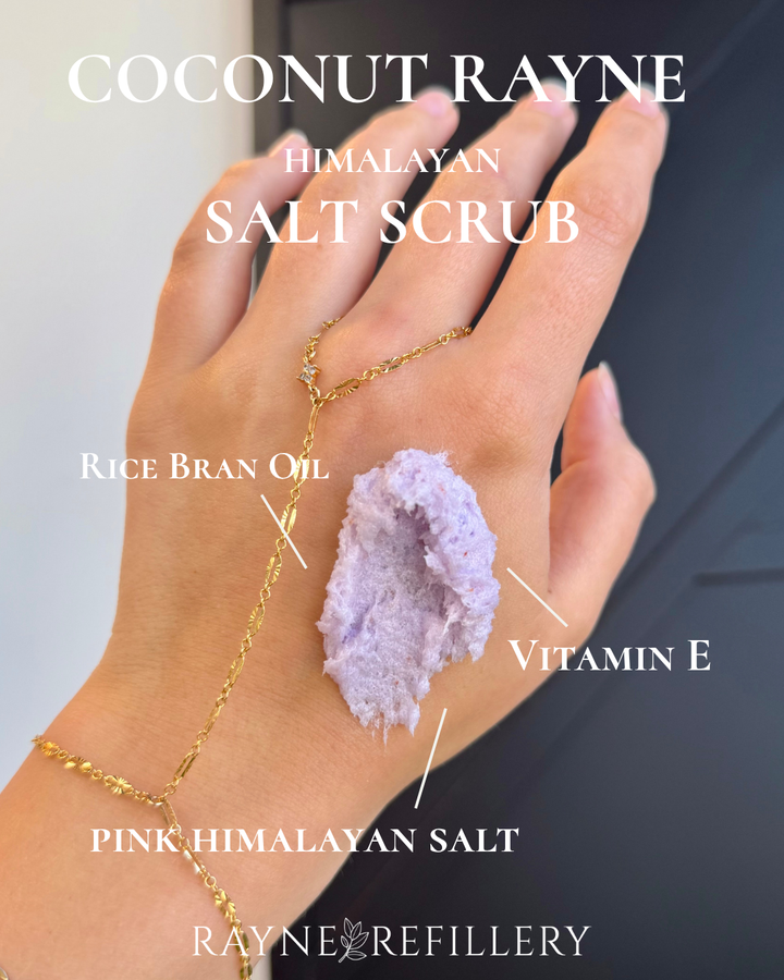 Whipped pink Himalayan salt scrub on hand, textured body exfoliant