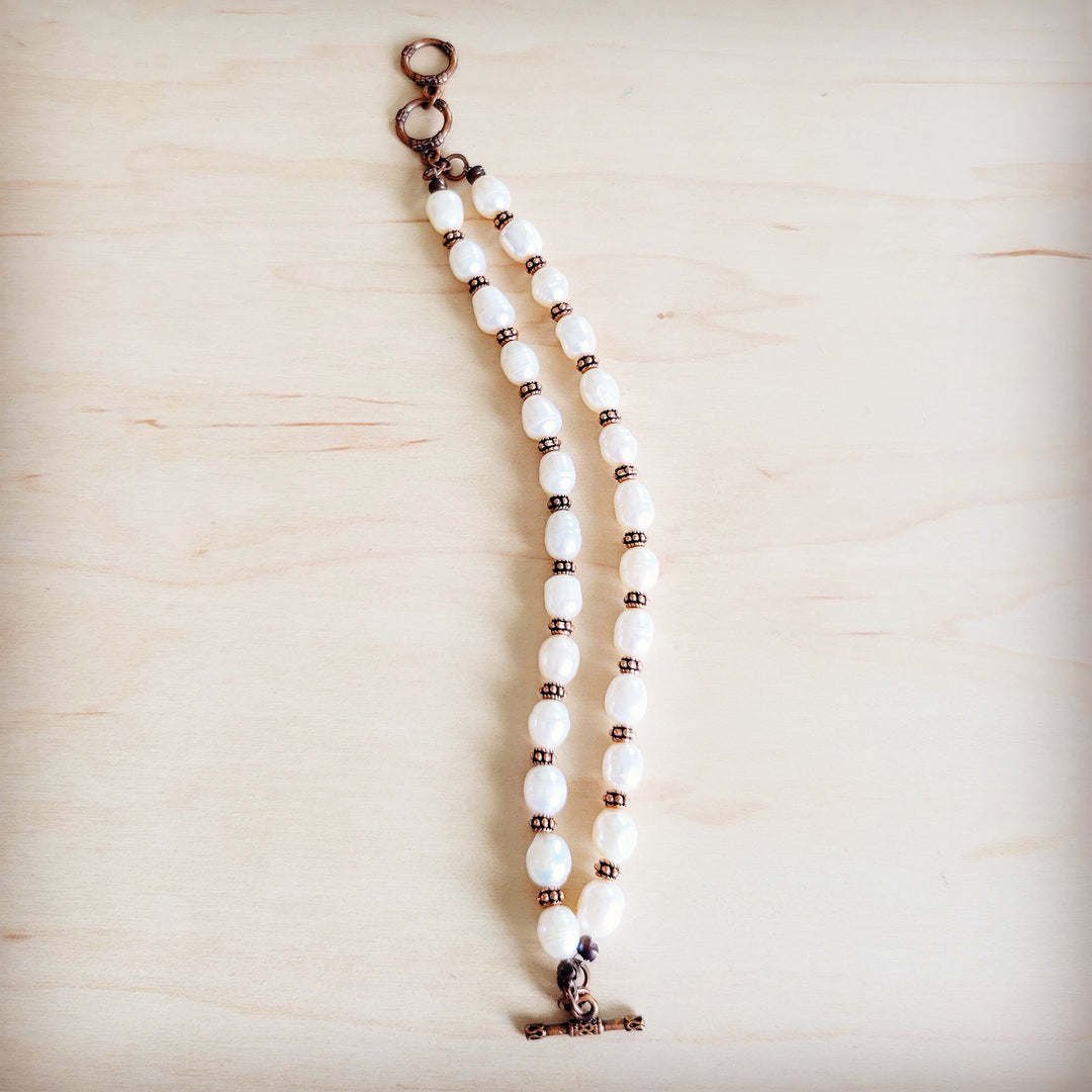 Freshwater pearl and copper beaded double-strand bracelet with long chain end and clasp