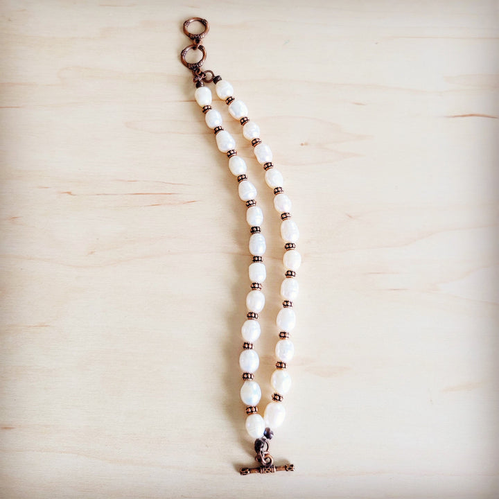 Freshwater pearl and copper beaded double-strand bracelet with long chain end and clasp
