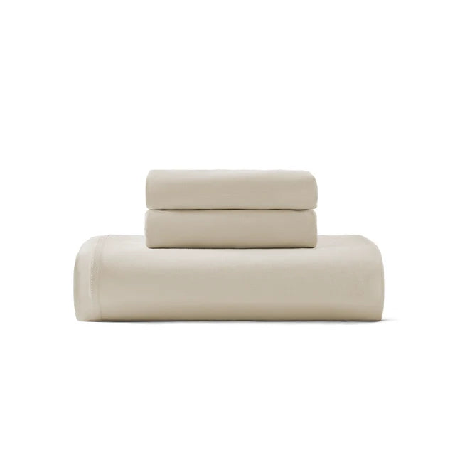 Cotton jersey duvet cover set in light beige, folded with top flap