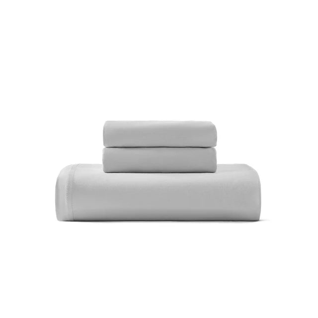 Cotton jersey duvet cover set in light gray, folded with top flap