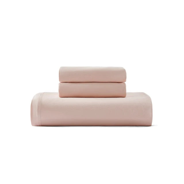 Cotton jersey duvet cover set in blush pink, folded with top flap