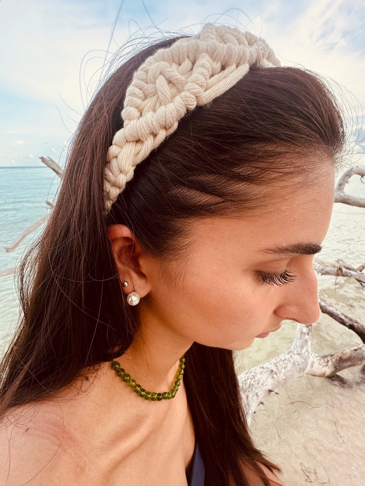 Peridot green gemstone beaded necklace on model with small amber/golden accent beads