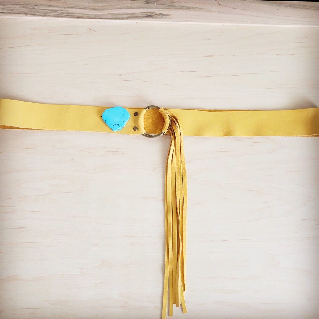 Mustard leather belt with long leather fringe and turquoise slab tag on strap
