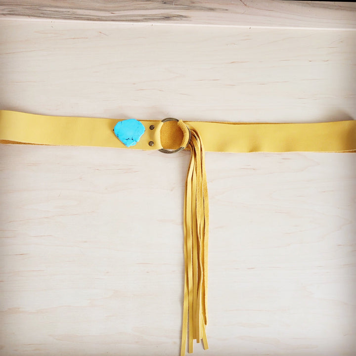 Mustard leather belt with long leather fringe and turquoise slab tag on strap