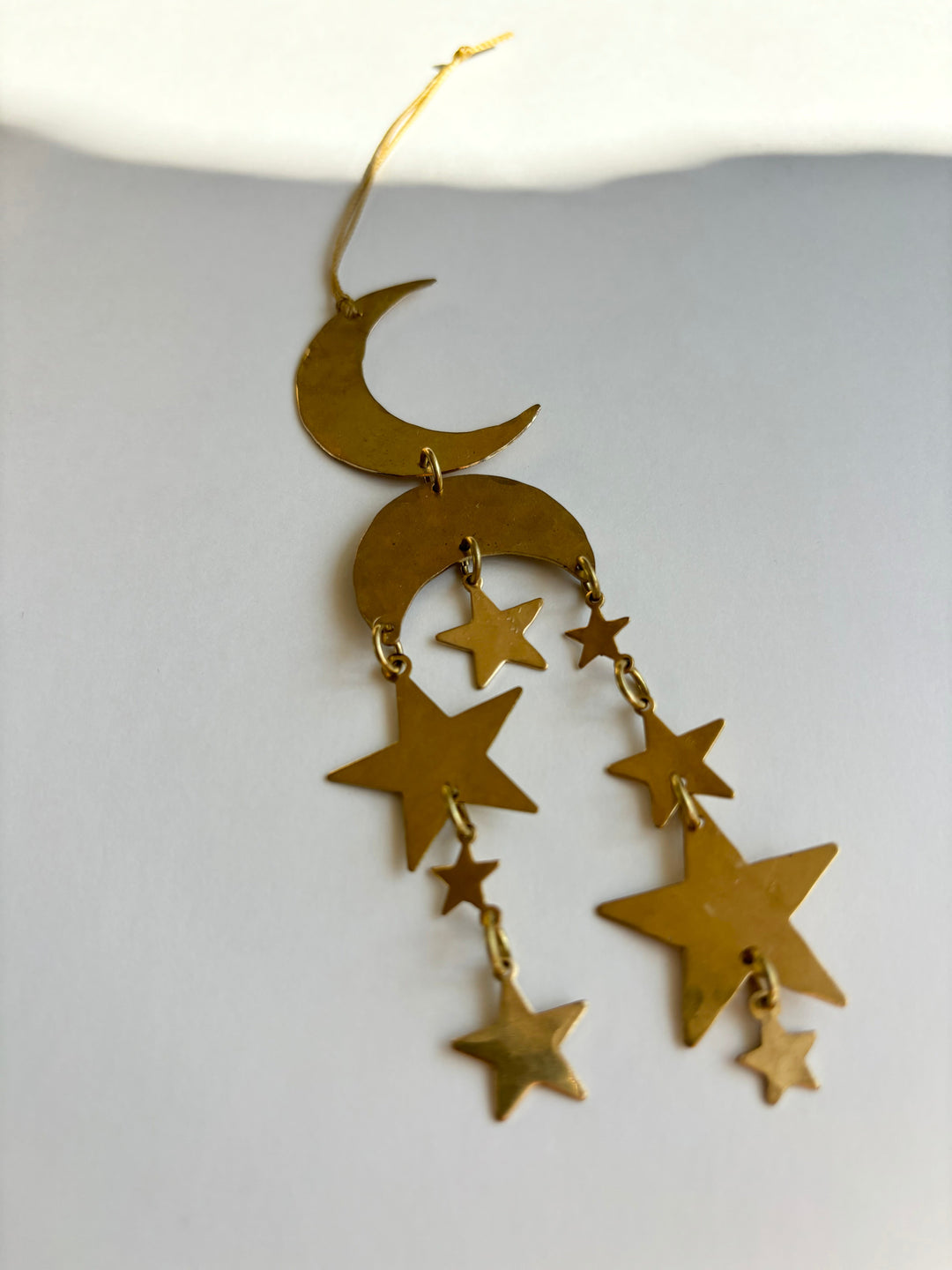 Gold star and crescent moon ornament with linked chains and hanging loop