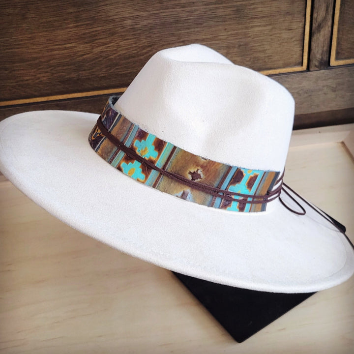 White felt wide-brim hat with turquoise, brown, and teal leather Navajo hat band