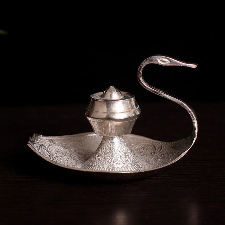Silver-toned swan incense holder with central pot and ornate round tray base