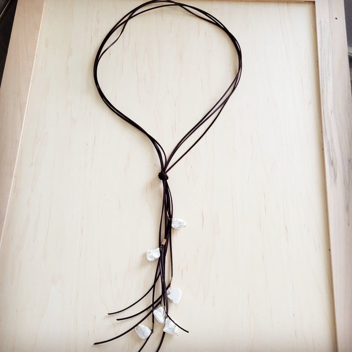 Dark brown knotted leather cord necklace with white pearl drops and fringe