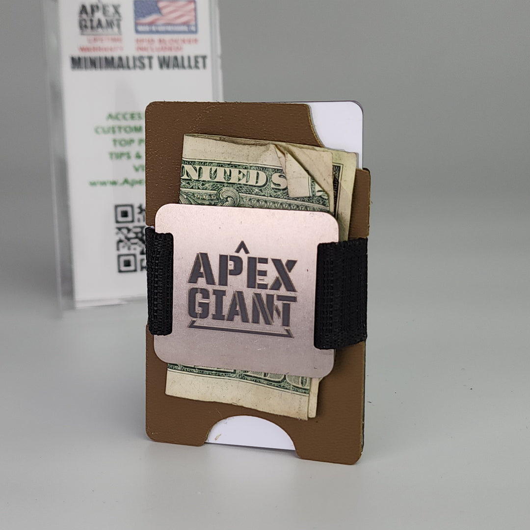 Coyote brown minimalist wallet with black elastic strap holding folded cash and APEX GIANT