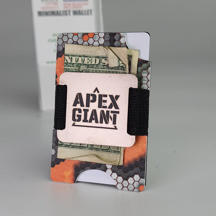 Hex-pattern minimalist wallet holding bills and cards, secured with black elastic strap.