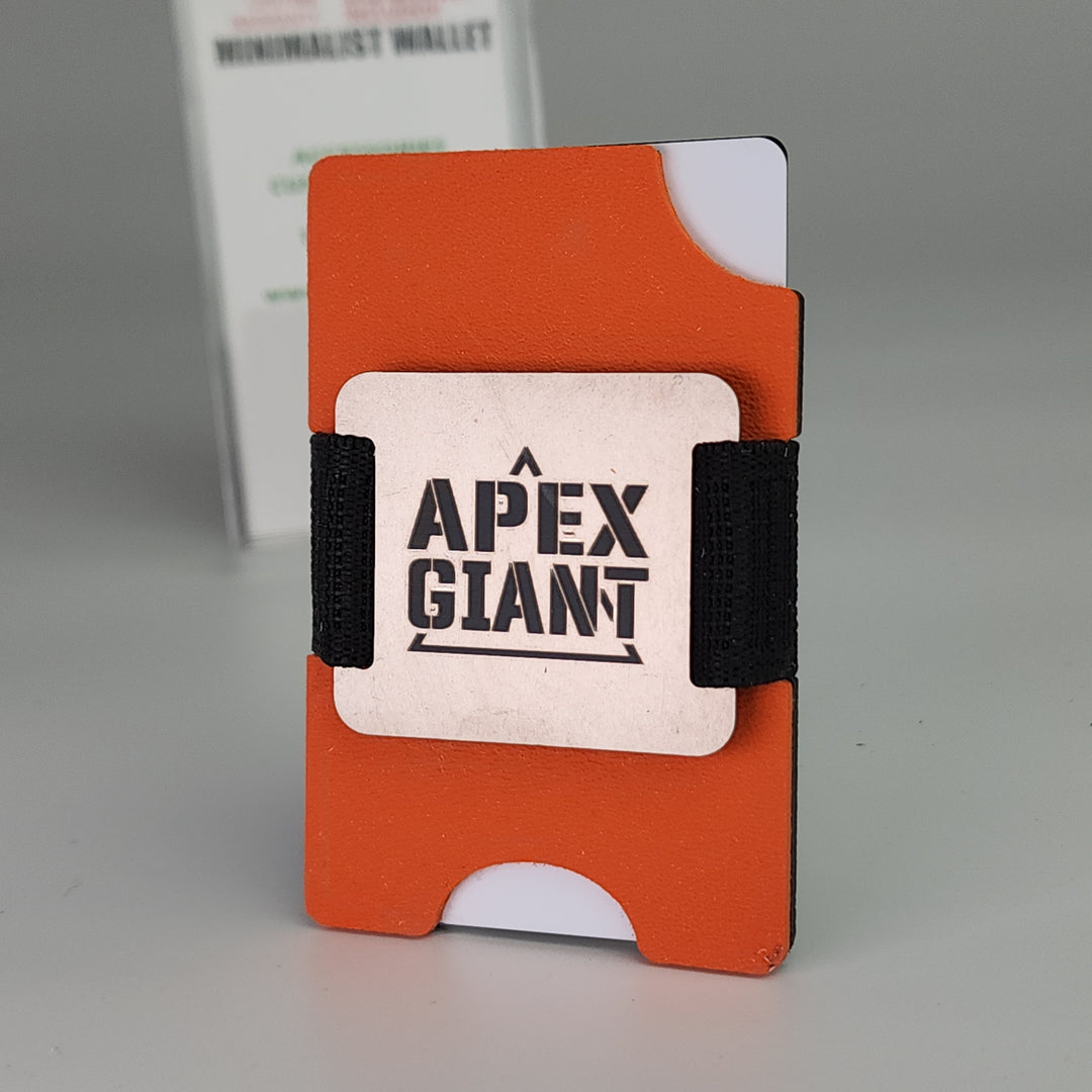 Hunter orange minimalist wallet with black elastic bands and APEX GIANT logo