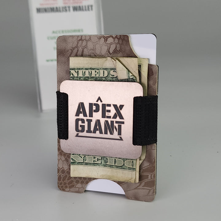 Camo minimalist wallet with black elastic strap holding cash and cards