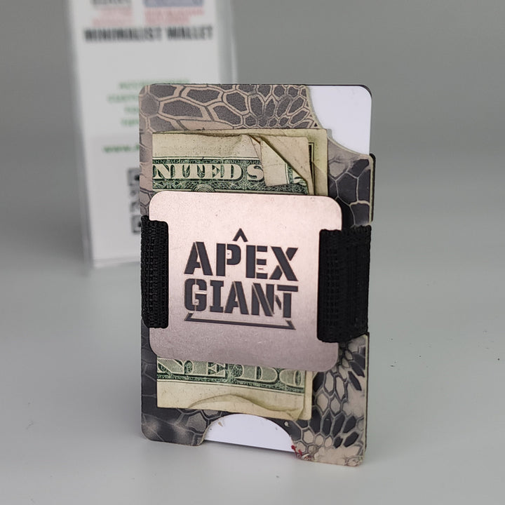 Minimalist wallet with Kryptek Raid camo print, cards and cash visible, black elastic strap