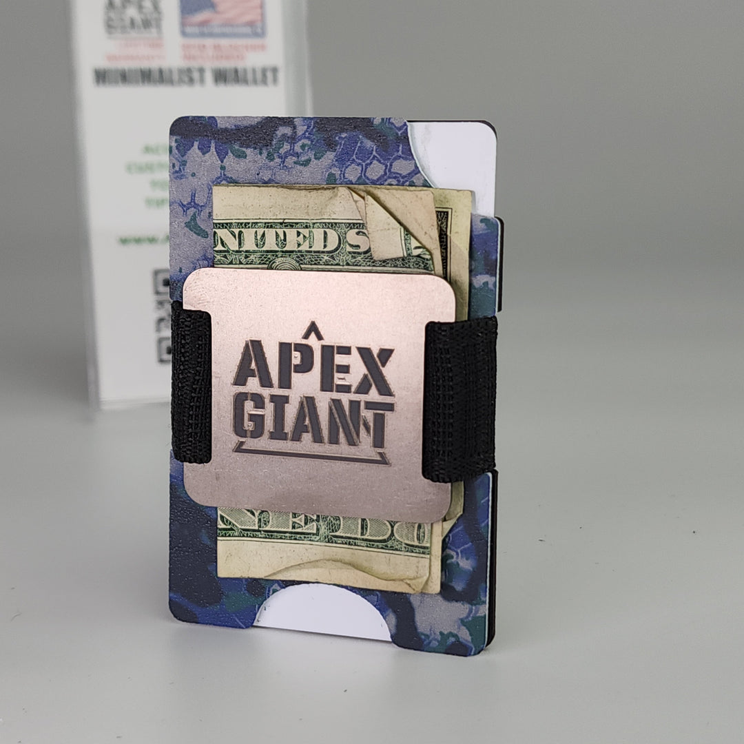 Ocean camo minimalist wallet holding cash and cards, secured with two black elastic straps