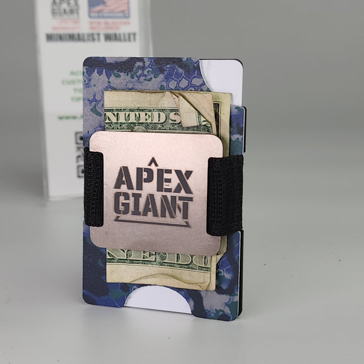 Ocean camo minimalist wallet holding cash and cards, secured with two black elastic straps