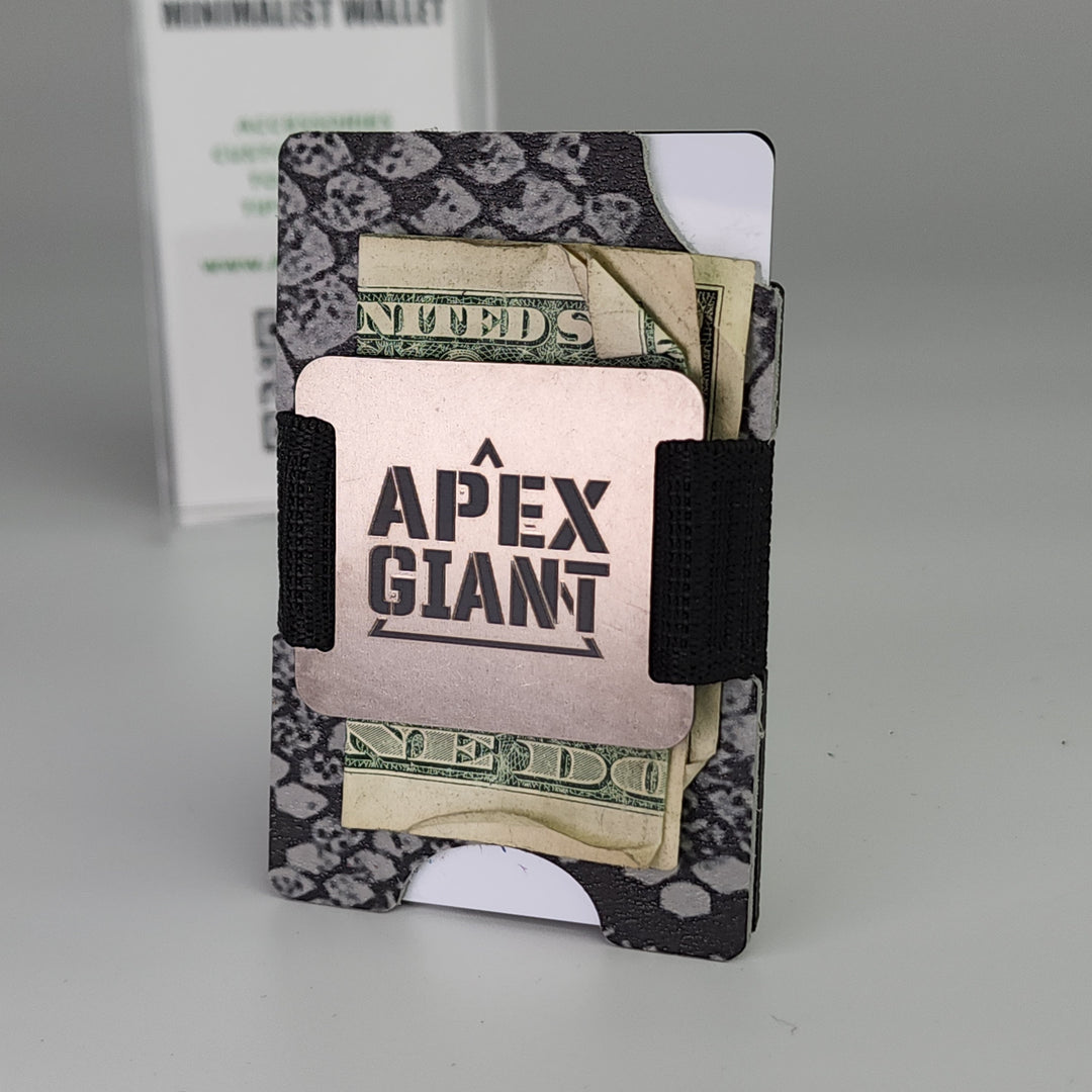 Gray snake-skin wallet with elastic band holding cash and cards