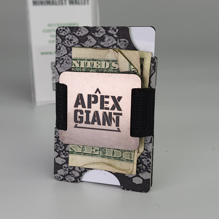 Gray snake-skin wallet with elastic band holding cash and cards