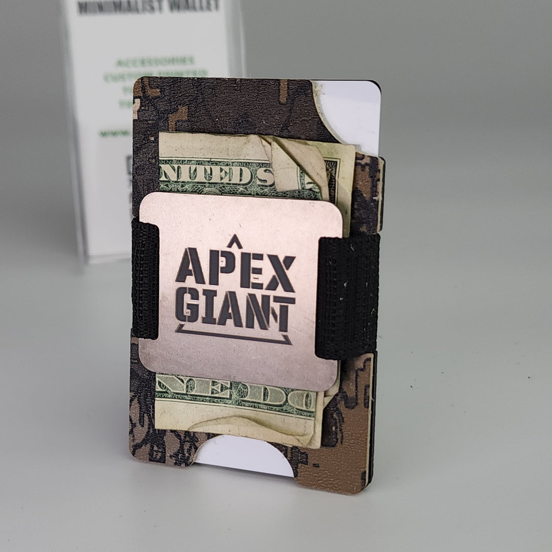Minimalist wallet open with US dollar bills and black elastic strap