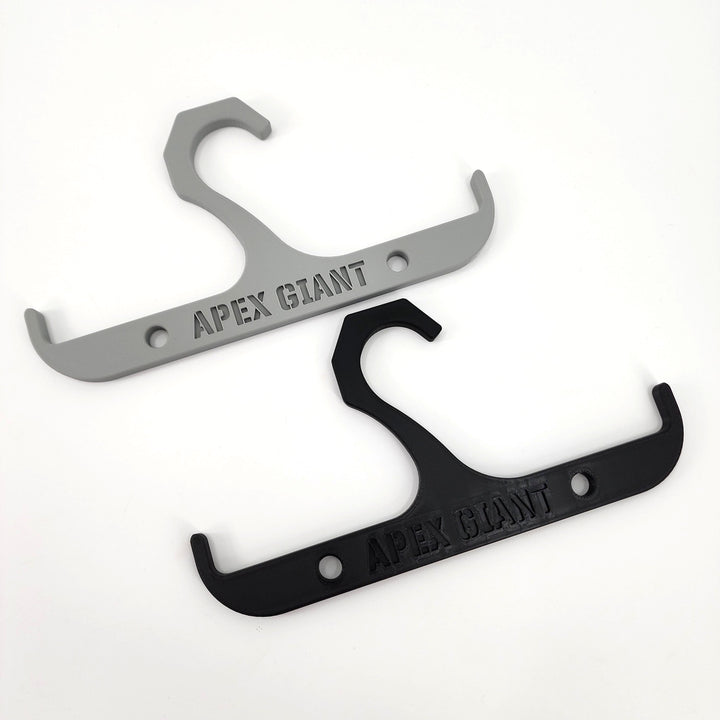 Gray and black backpack hanger with curved hooks and mounting holes