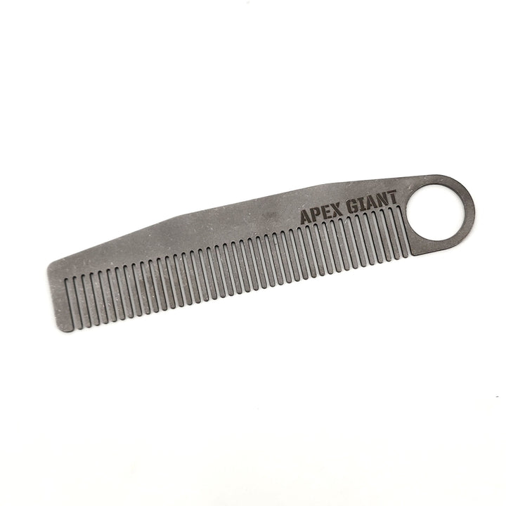 Titanium pocket comb with ring handle and fine tooth rake, engraved logo