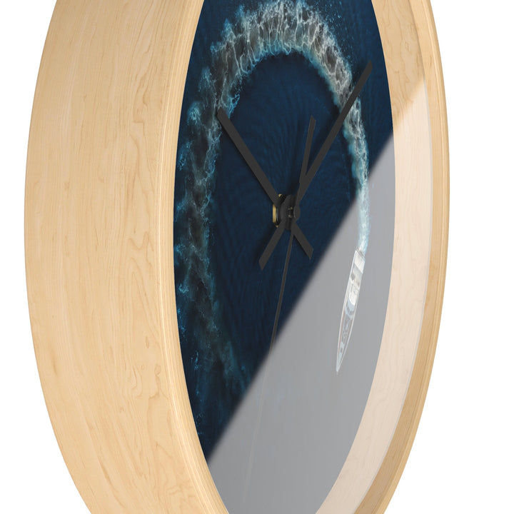 Round wall clock close-up side view, blue nautical face, wooden rim, black hands