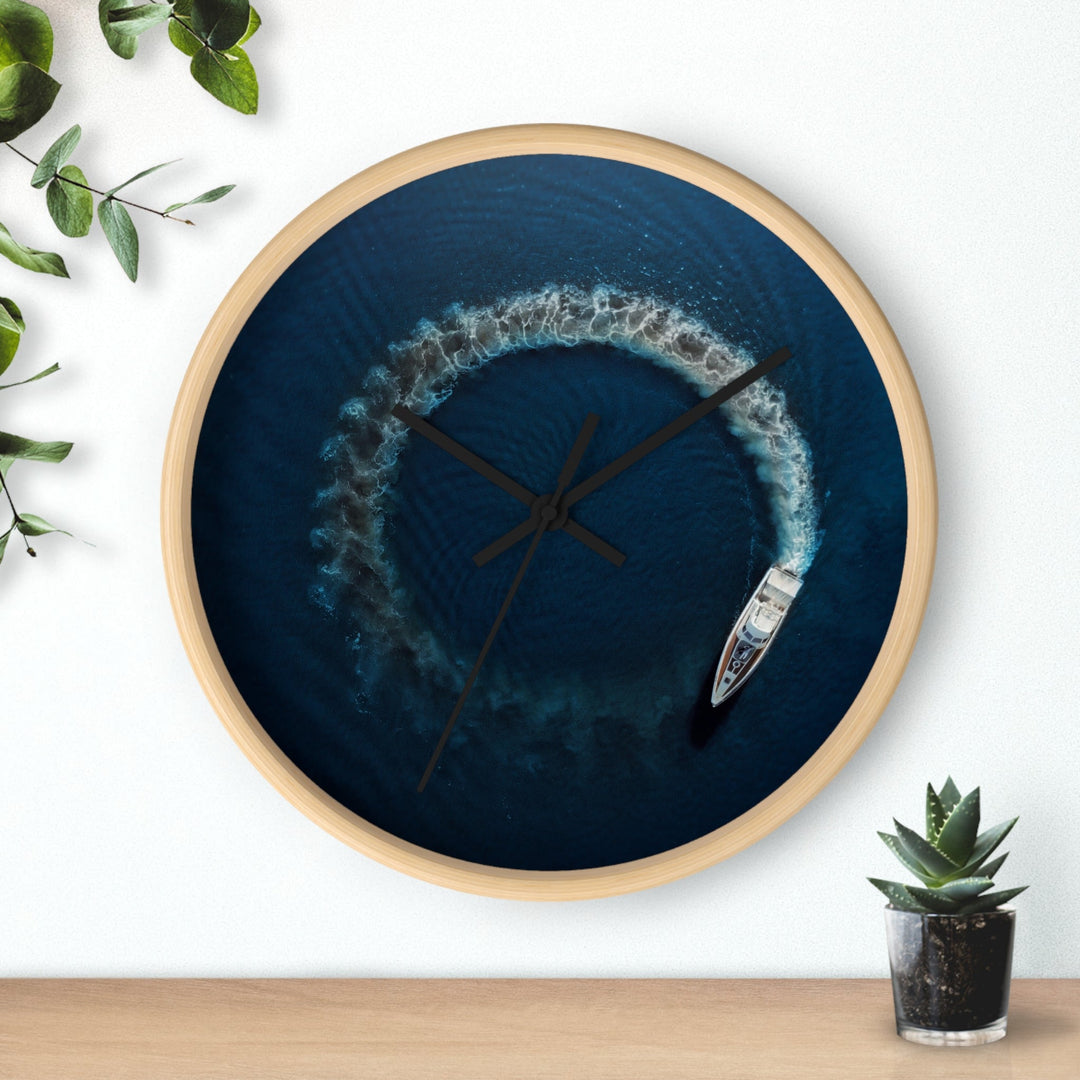 Round wall clock with blue nautical artwork, wooden rim, black clock hands