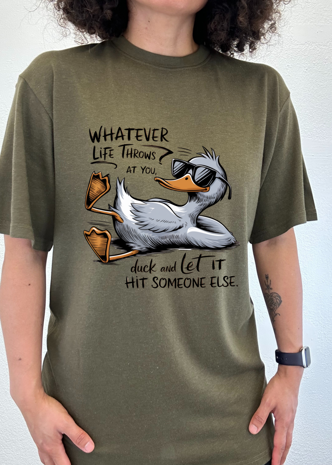 Olive green unisex graphic T-shirt with duck illustration and motivational text