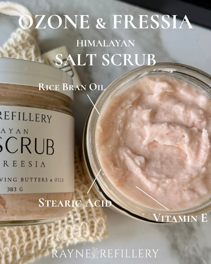 Open Himalayan salt scrub jar with thick whipped pink cream texture