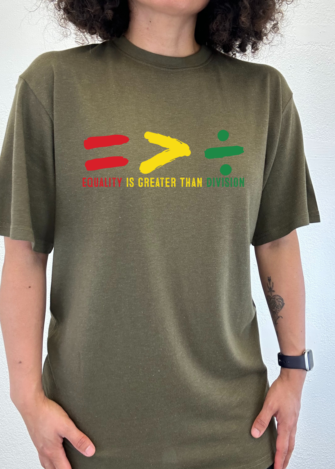 Olive green unisex crew-neck T-shirt with multicolor equality graphic and text.