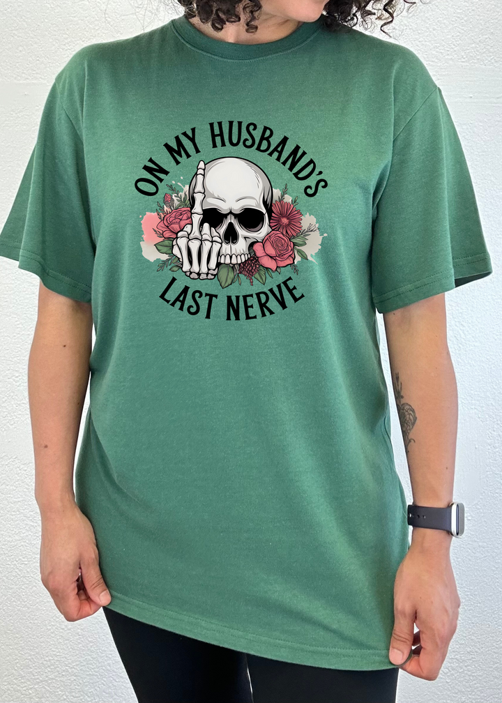 Green unisex graphic t-shirt with skull, roses, and &