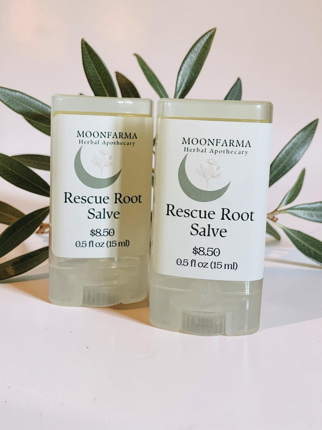 Rescue Root Salve two small balm jars with white labels and green botanical accents