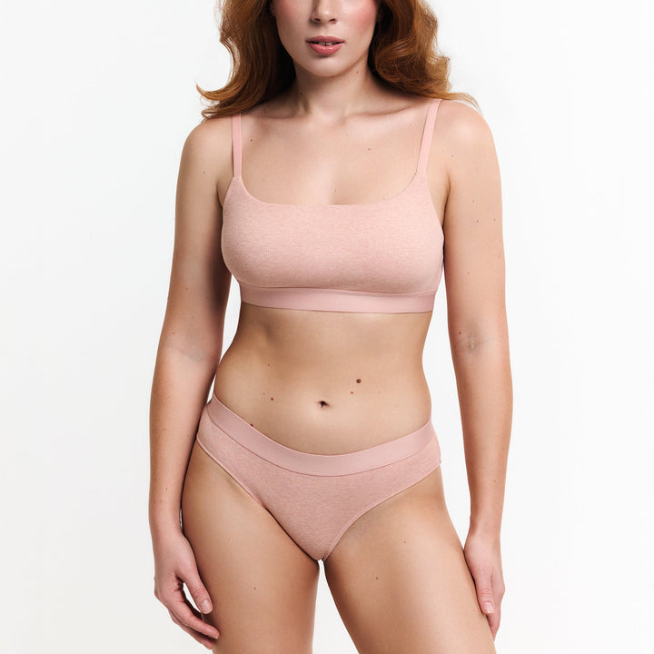 Peach mid-rise brief with smooth bikini cut and high leg openings
