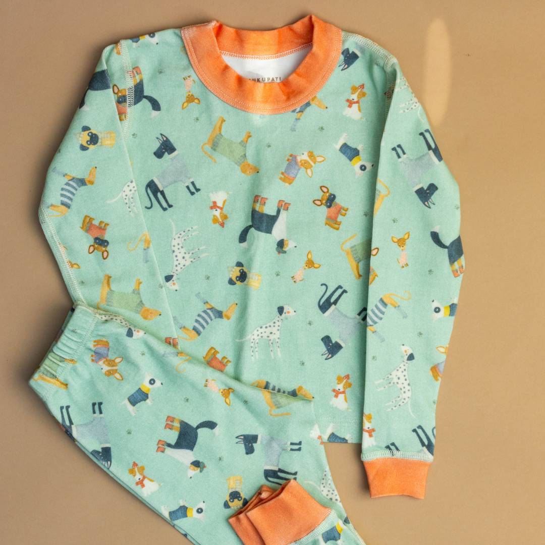 Teal long-sleeve pajama set with orange neckline, matching cuffs, and animal pattern