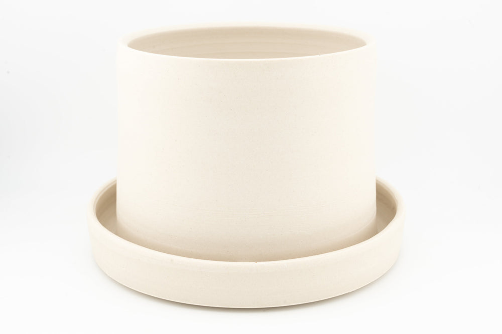 White unglazed stoneware tabletop planter with drainage tray, round open pot