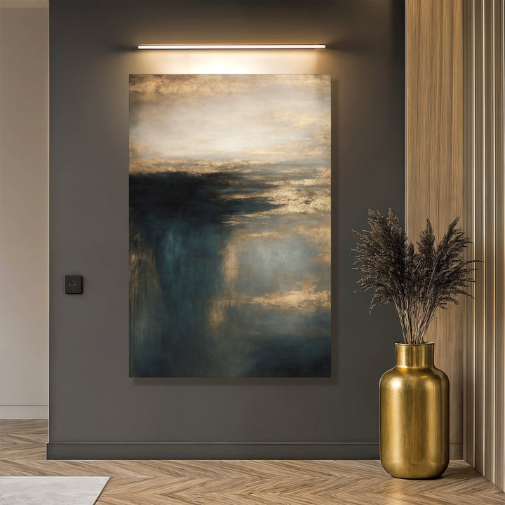 Framed cloudscape wall art canvas in teal and gold tones on a gray wall.