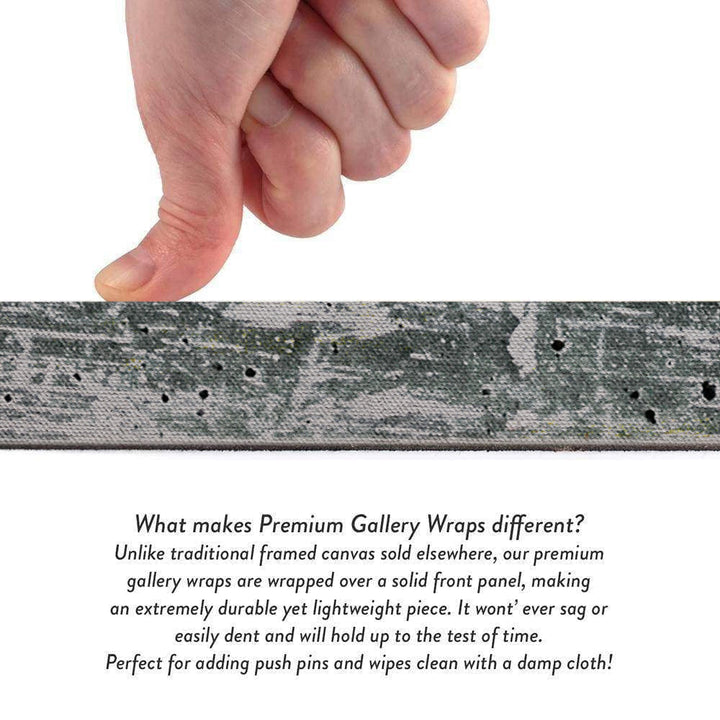 Close-up of canvas wrap material being pressed by hands, showing cloudscape print texture.