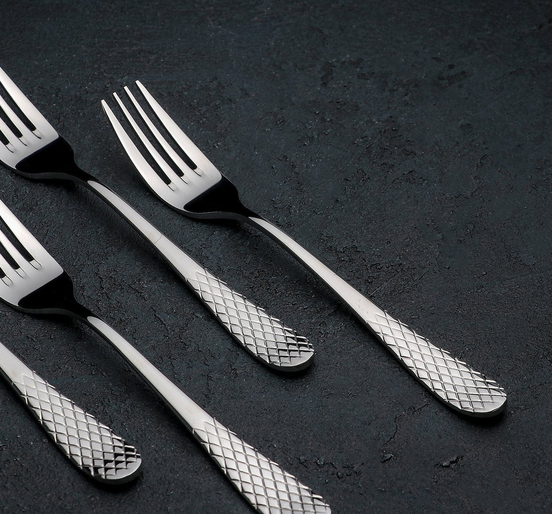 Dinner fork set with black handles and diamond-patterned handle fronts