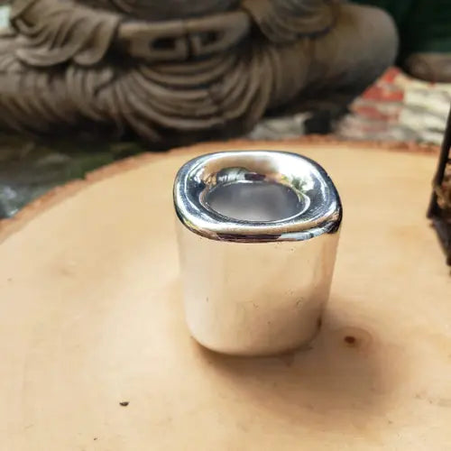 Silver ceramic candle holder with reflective metal rim, open top for tea light