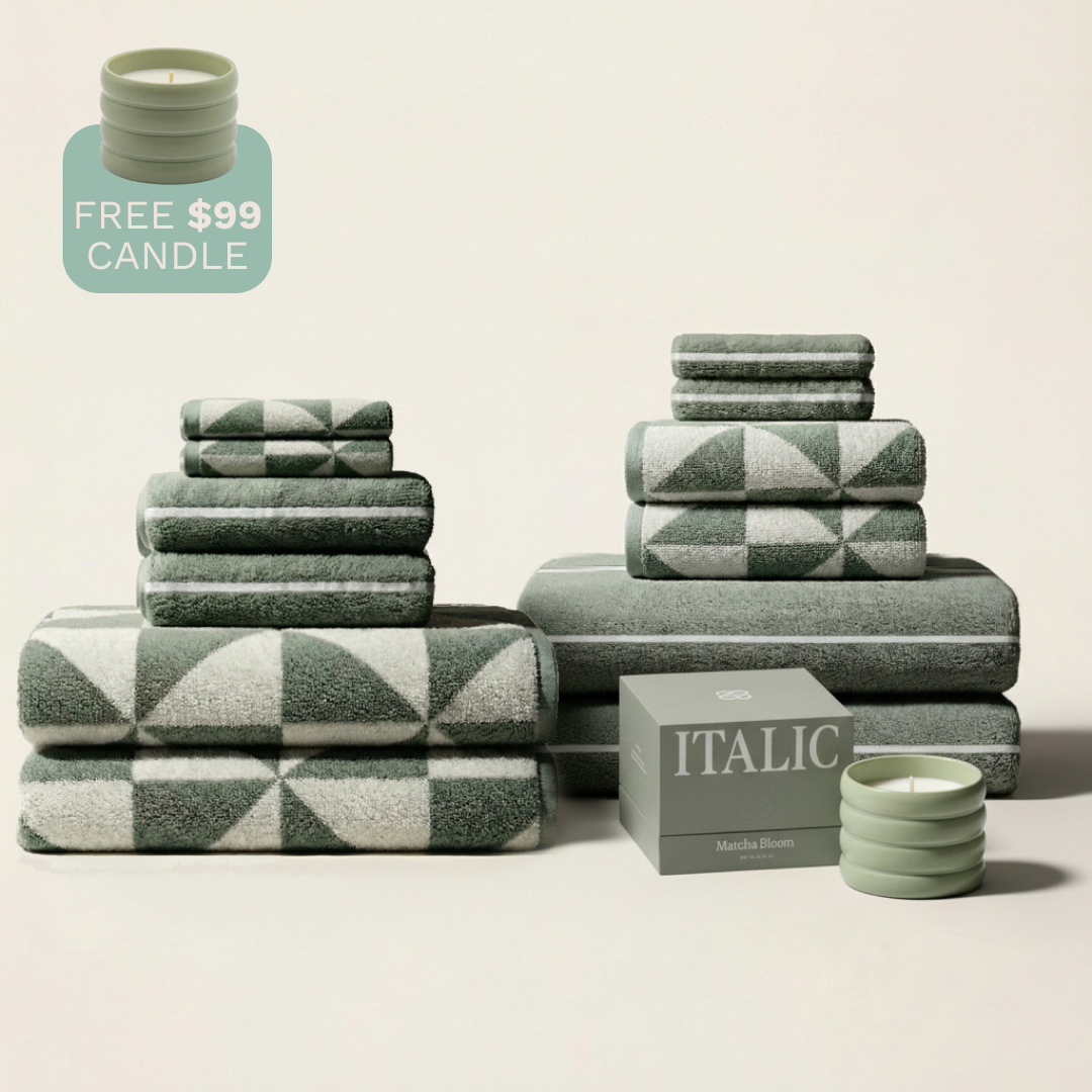 Assorted green-and-ecru cotton towels, mixed-pattern stacked set display.