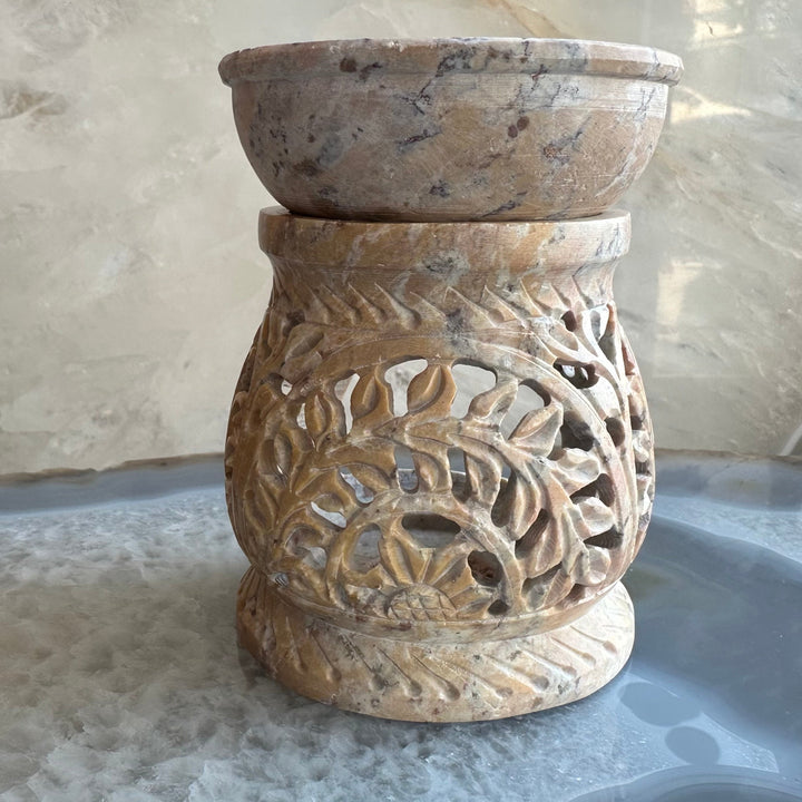 Carved soapstone essential oil burner with lattice cutout and leaf swirl carving
