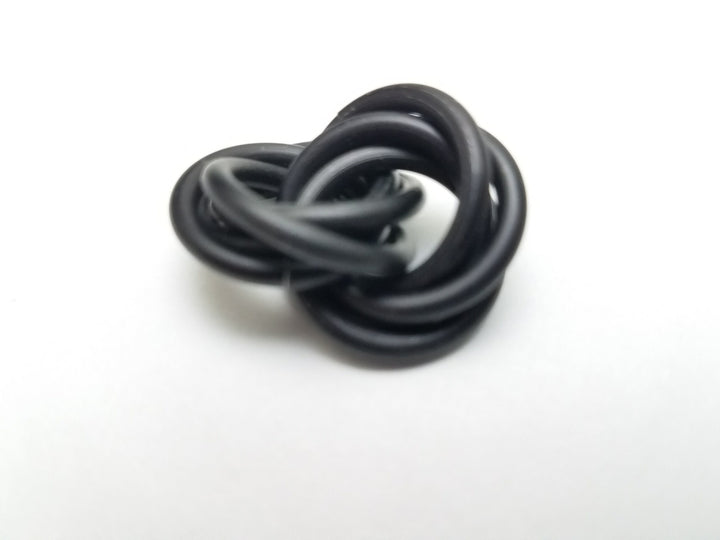 Dark gray metallic stress fidget ball with coiled loop design