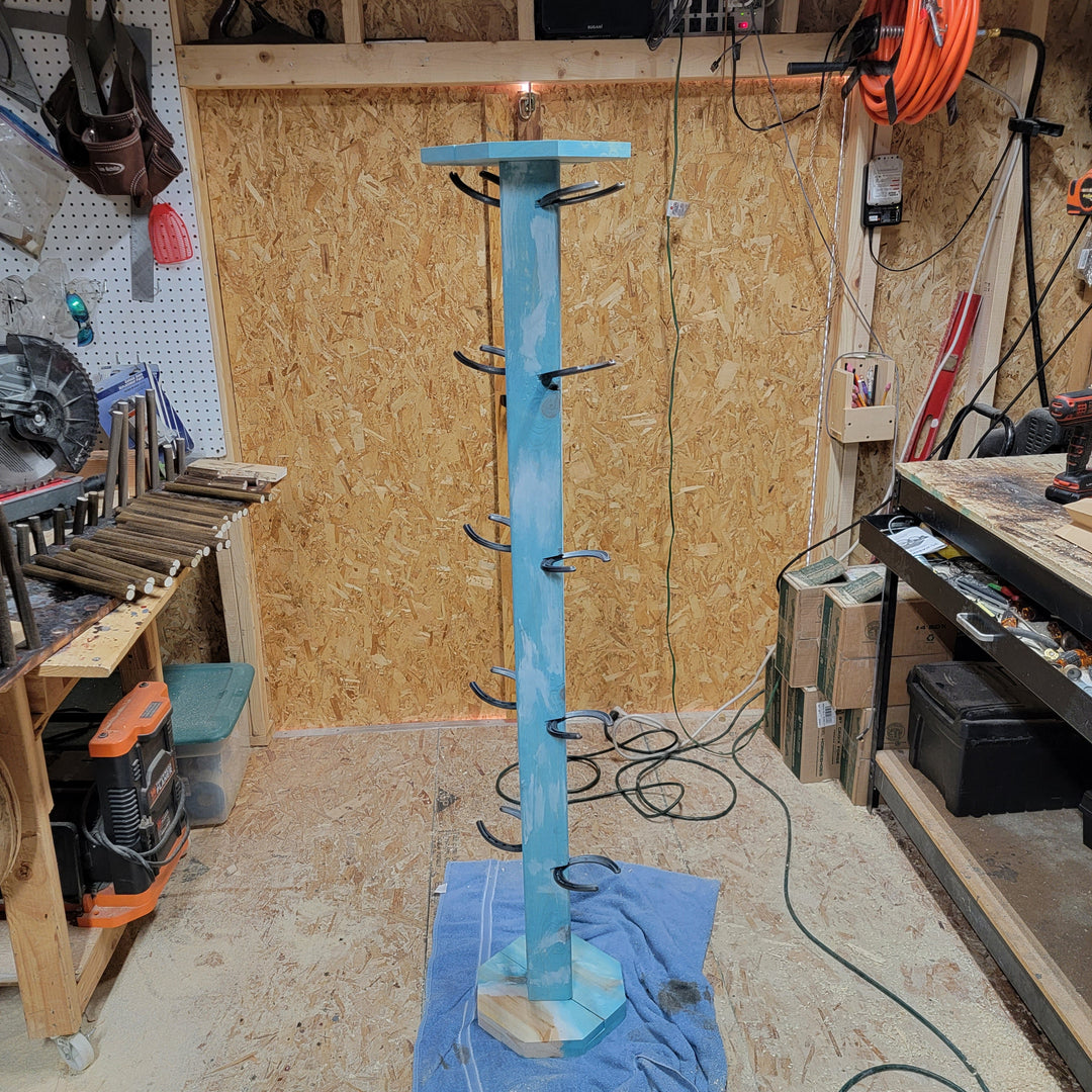 Blue and light-wood cowboy boot floor stand with horizontal peg bars for boots