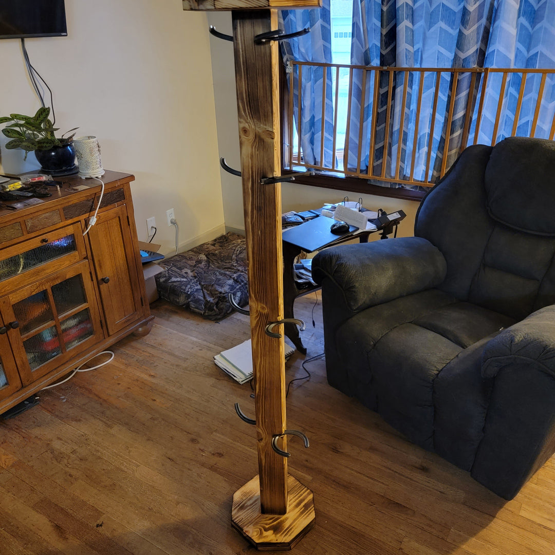 Wooden upright cowboy boot floor stand with side pegs and stable square base