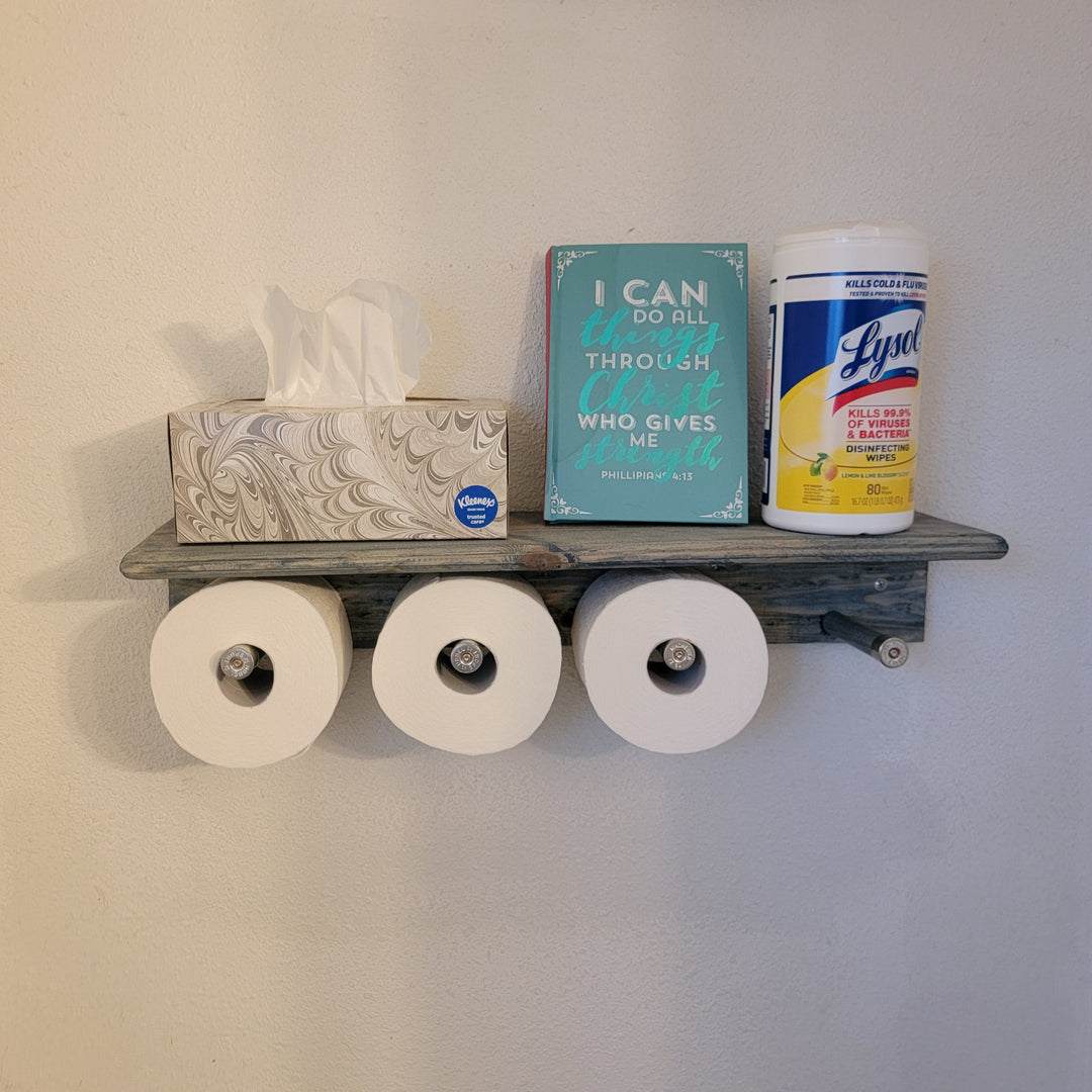 Wood toilet paper shelf with three toilet paper rolls underneath