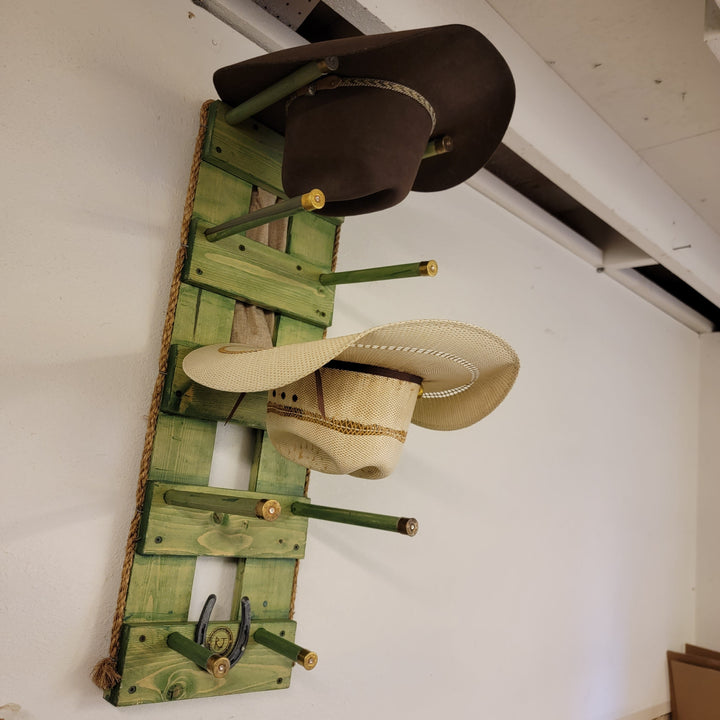 Green wooden vertical wall hanging organizer with hat and rope accessories