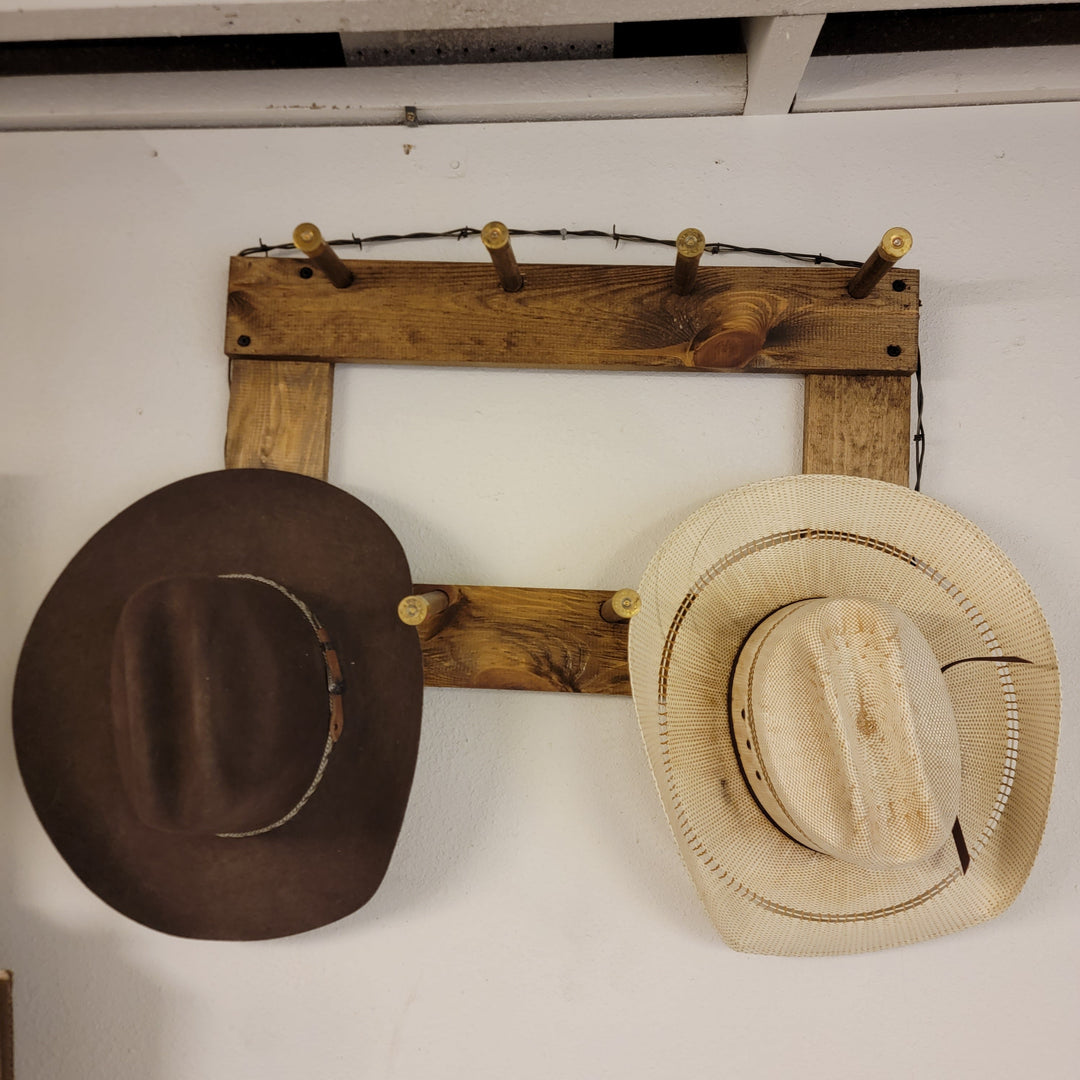 Vertical wall-hanging ball cap organizer with dark brown and beige straw hats