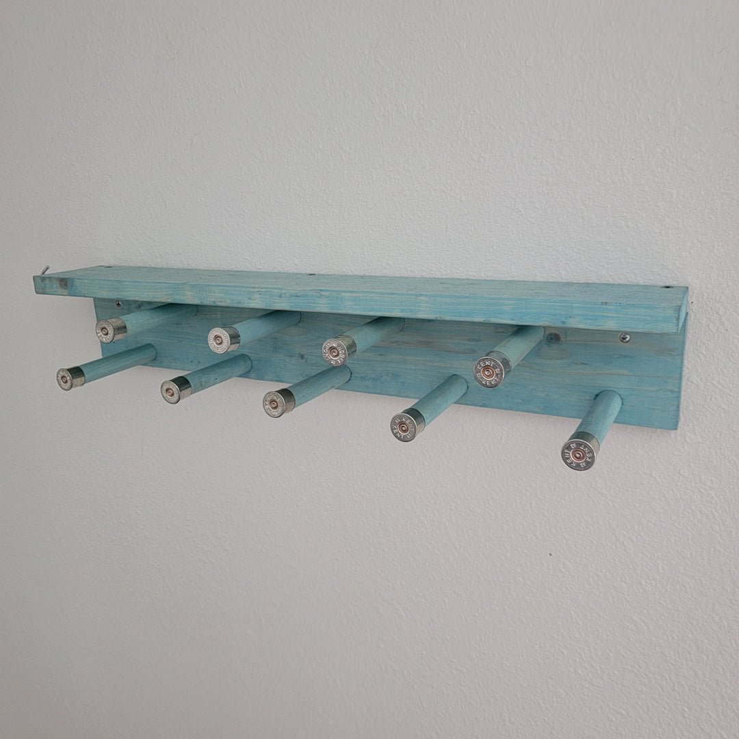 Blue scarf rack shelf with multiple hanging peg arms for scarves
