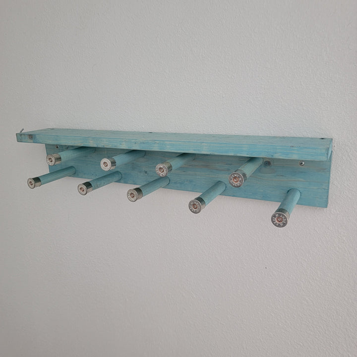 Blue scarf rack shelf with multiple hanging peg arms for scarves