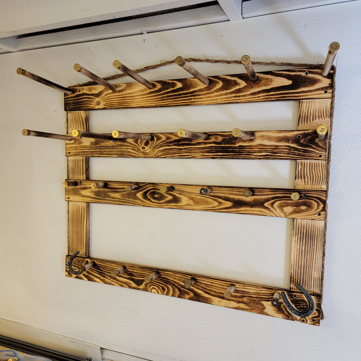 Wood hat display frame with hanging pegs and an empty center opening